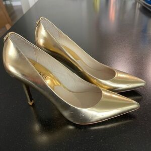 Michael Kors gold patent pumps